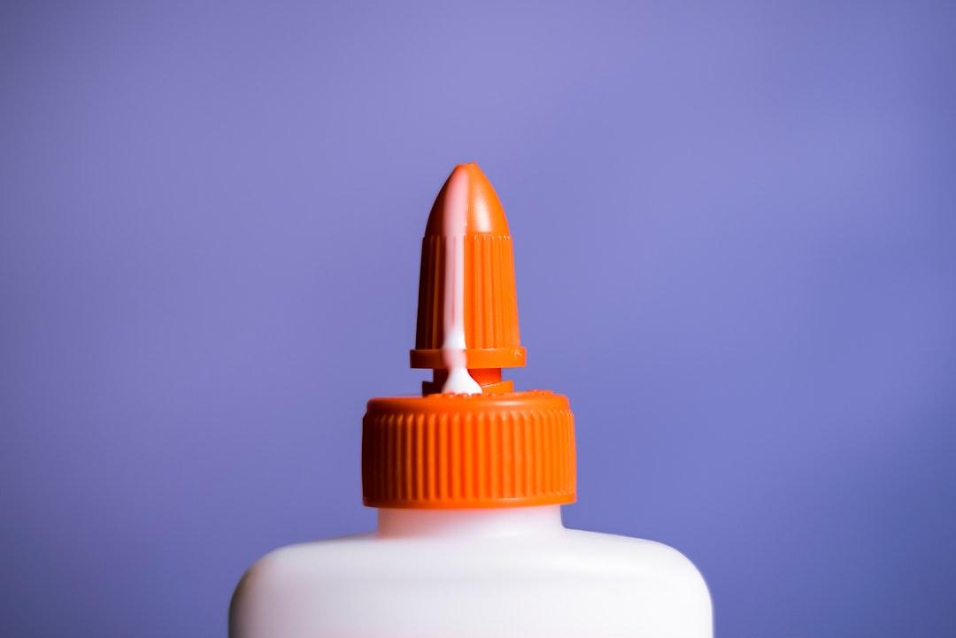 Spilled glue on bottle from Scott Sanker on Unsplash