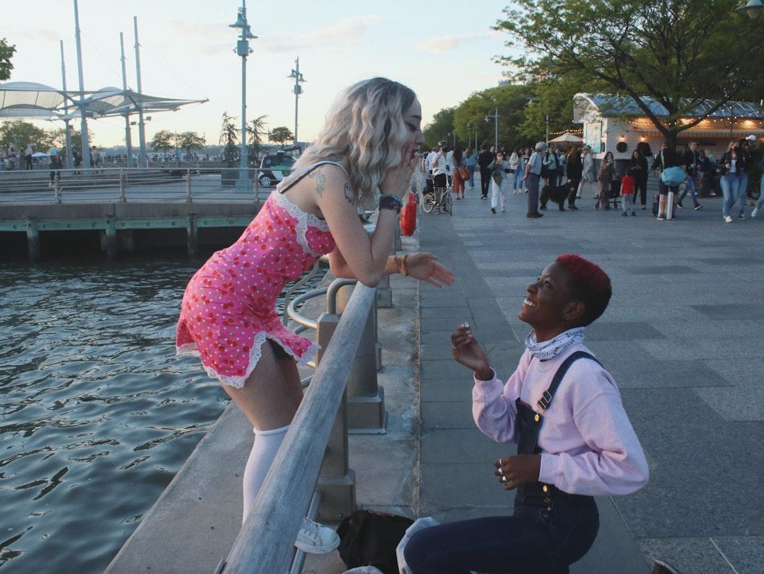 Girl in pink dress standing beside man in white dress shirt from Jakayla Toney on Unsplash