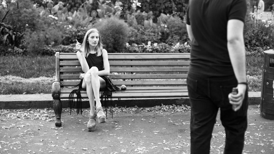 Grayscale photography of woman sitting near man from Alev Takil on Unsplash