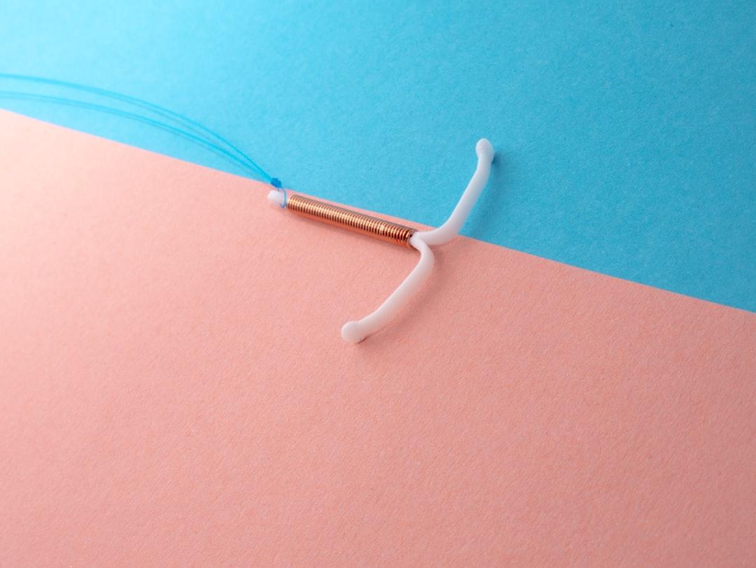 White plastic tool from Reproductive Health Supplies Coalition on Unsplash
