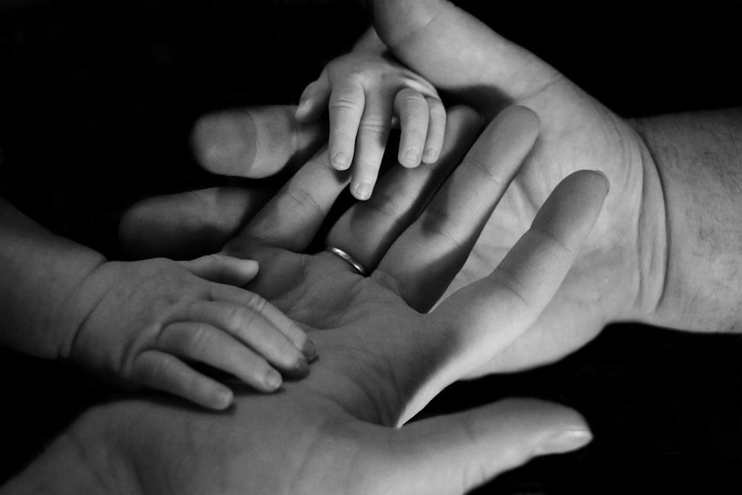 Babys hand on human palm from Liv Bruce on Unsplash Nói 'chuyện khó nói' với con trẻ