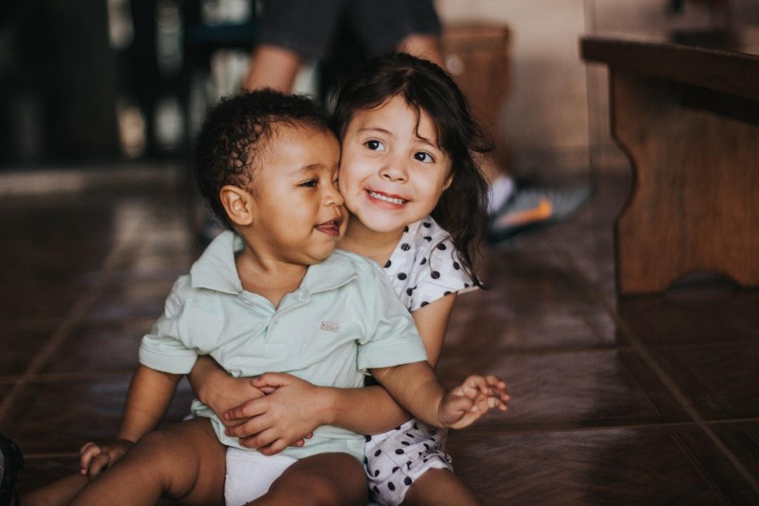 Selective focus photography of girl hugging boy from Chayene Rafaela on Unsplash