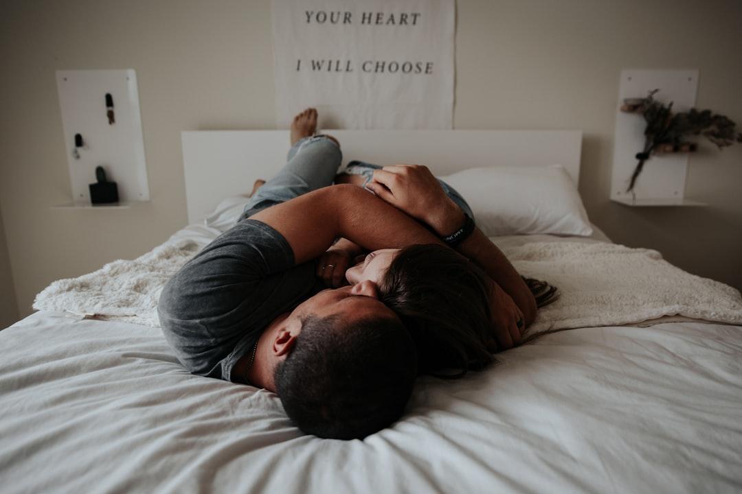A man and woman cuddling together in bed. from Becca Tapert on Unsplash