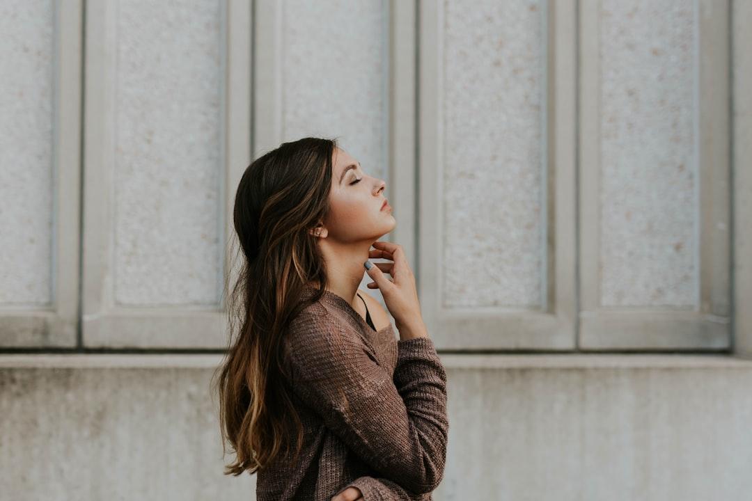 Woman in brown long-sleeved top standing beside wall from Brooke Cagle on Unsplash