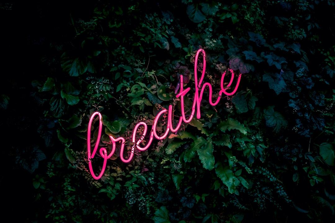 Pink breathe neon sign from Fabian Møller on Unsplash
