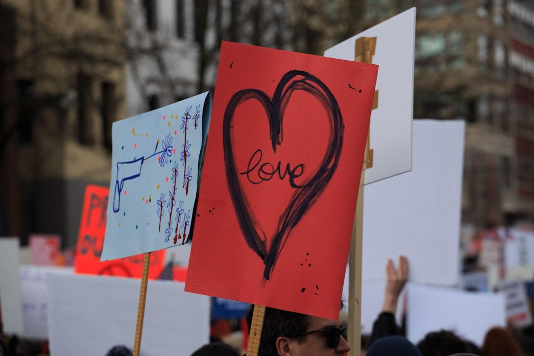 Person holding up love sign from Ben Mater on Unsplash