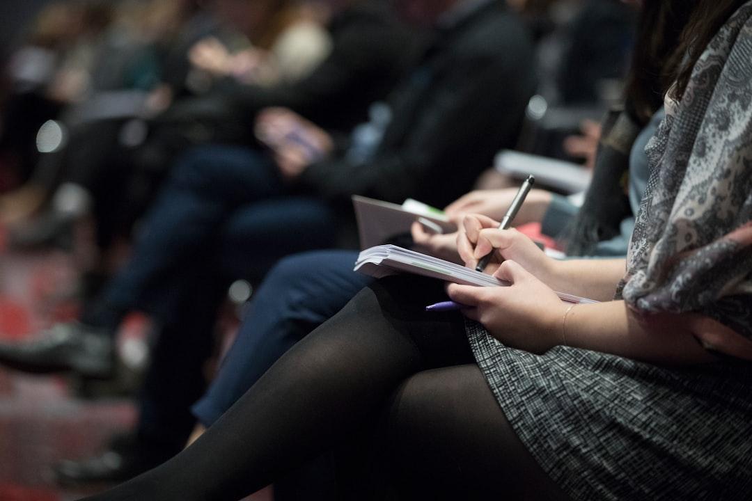Selective focus photography of people sitting on chairs while writing on notebooks from The Climate Reality Project on Unsplash Điều trị tai biến mạch máu não bằng phương pháp mới