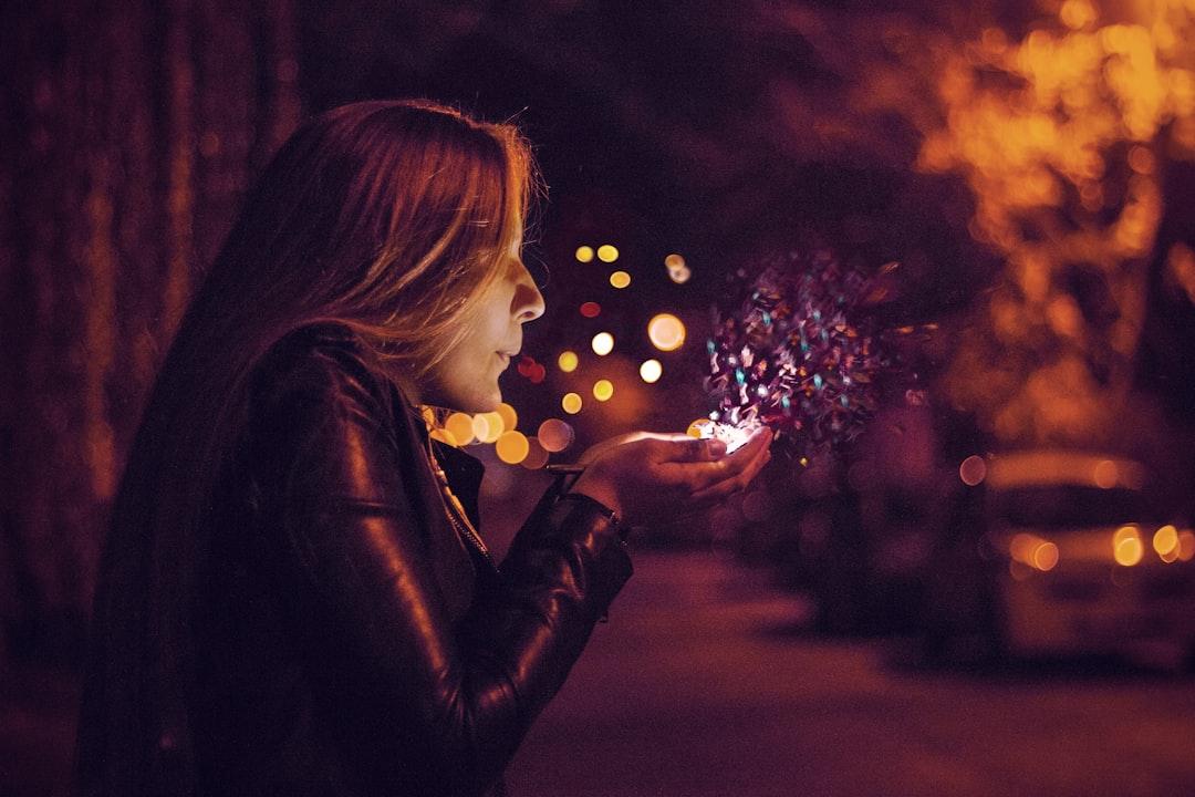 Woman blowing sprinkle in her hand from Almos Bechtold on Unsplash "Ma lực" giữ chồng
