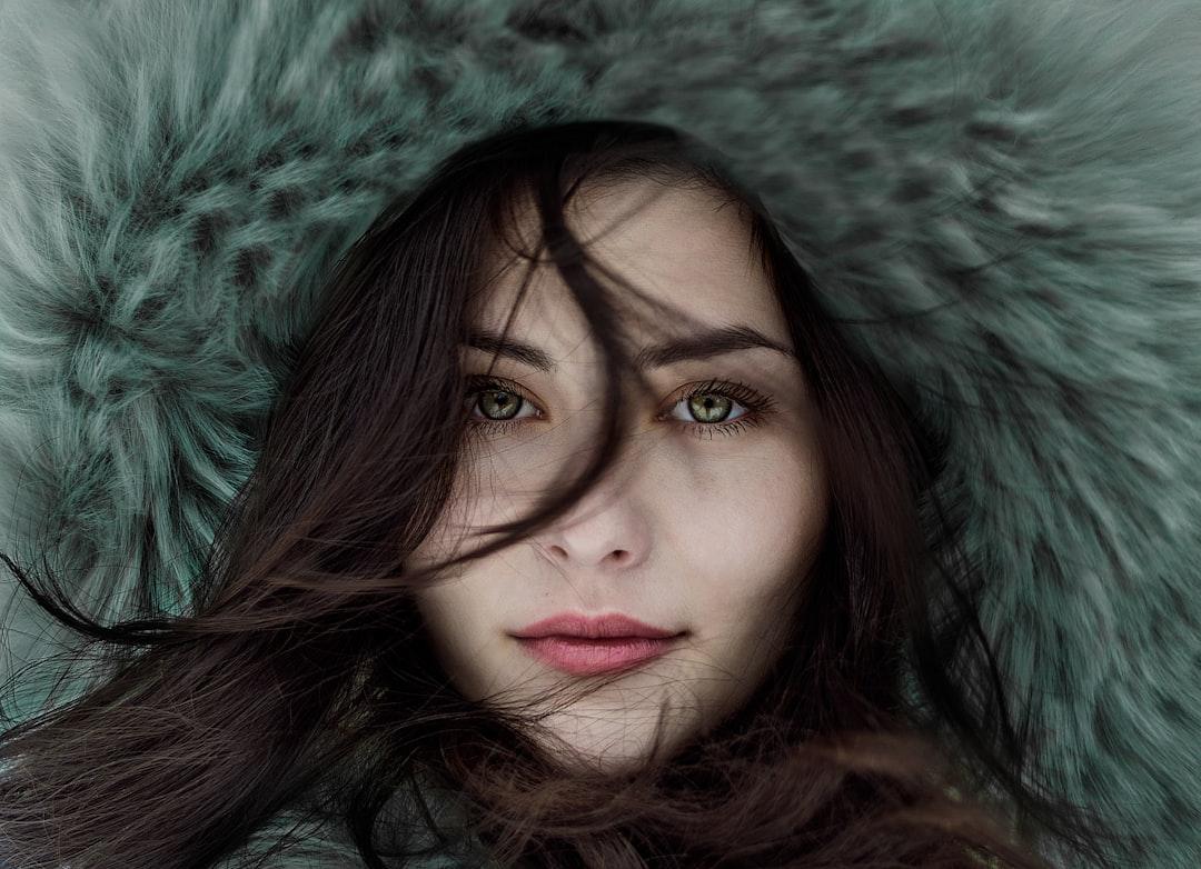 Woman wearing fur hoodie from Alexandru Zdrobău on Unsplash Ung thư vú gia tăng ở người trẻ