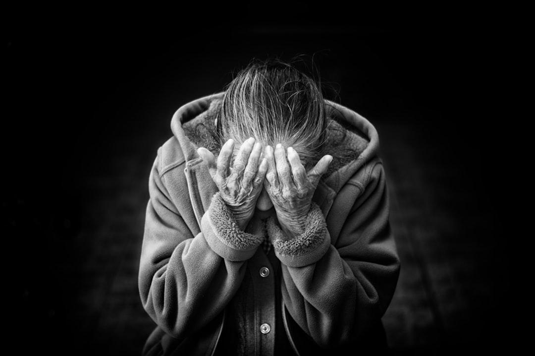 Grayscale photography of person covering face from Danie Franco on Unsplash Omega-3 có ích cho phụ nữ mãn kinh