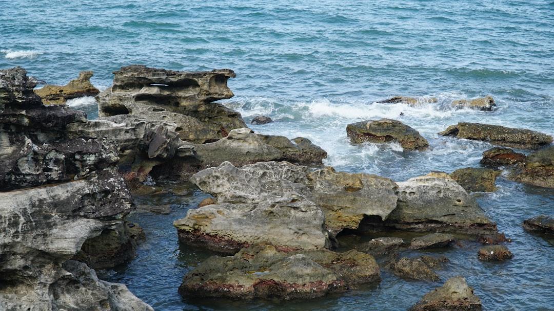 A group of rocks sitting on top of a body of water from Phương Nhi on Unsplash Kiên Giang: Gần 1.000 trường hợp sốt xuất huyết