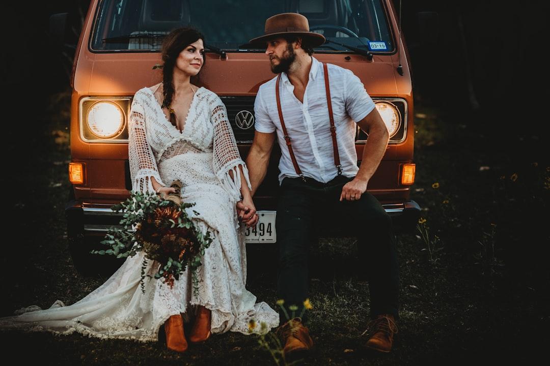 Man holding hands of woman while leaning on brown volkswagen vehicle from Jessica Rockowitz on Unsplash Làm gì khi chàng lơ là 'chuyện ấy'