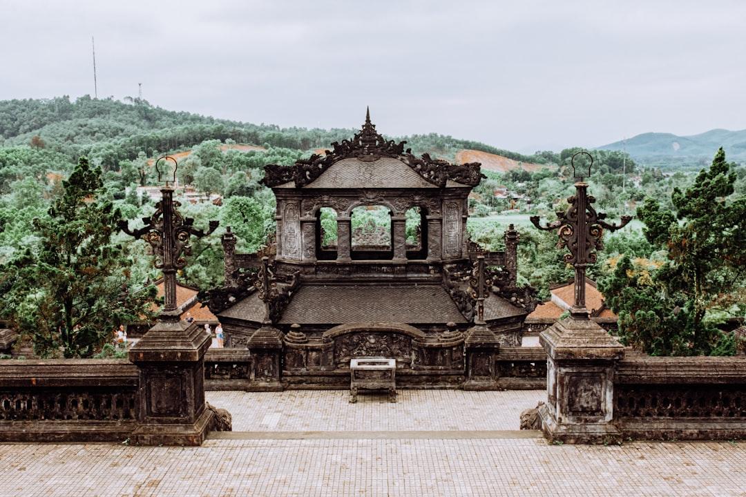 A majestic, ornate temple overlooks lush green hills. from Daniele Franchi on Unsplash TT-Huế: 14 học sinh mắc cúm A/H1N1