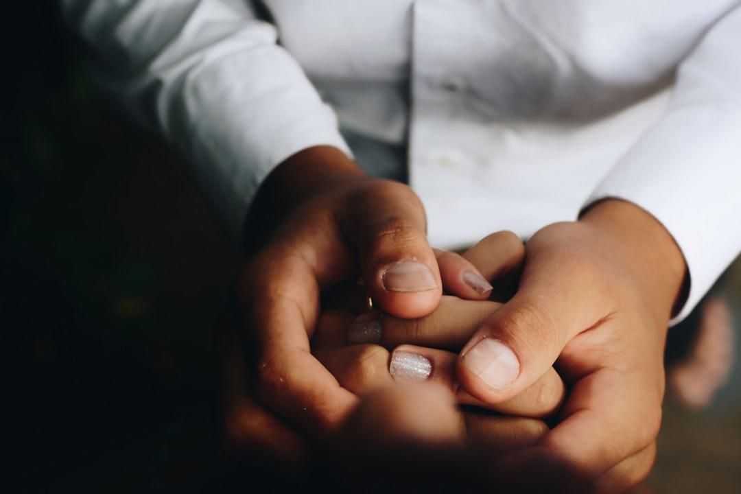 Person holding hands from Matheus Ferrero on Unsplash Sinh mổ nên kiêng gì?