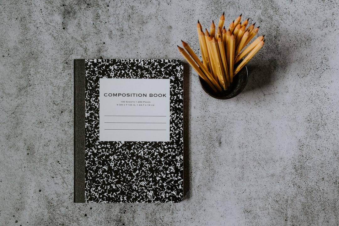 Black and white book on gray marble table from Kelly Sikkema on Unsplash Phòng chống tật khúc xạ ở học sinh: Tìm đủ cách