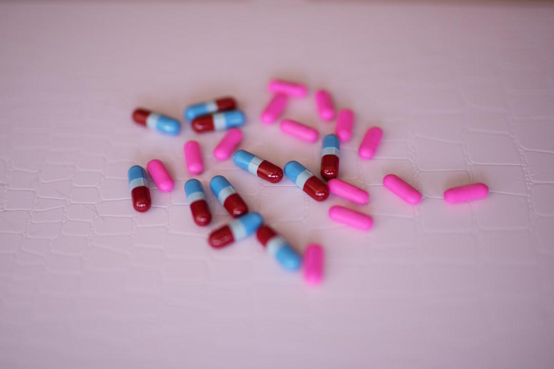 Capsules on white panel from Thought Catalog on Unsplash