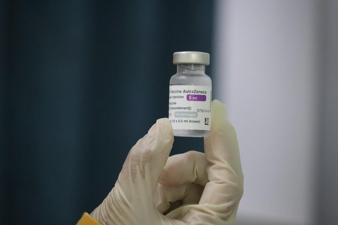 Person holding white plastic bottle from Mufid Majnun on Unsplash