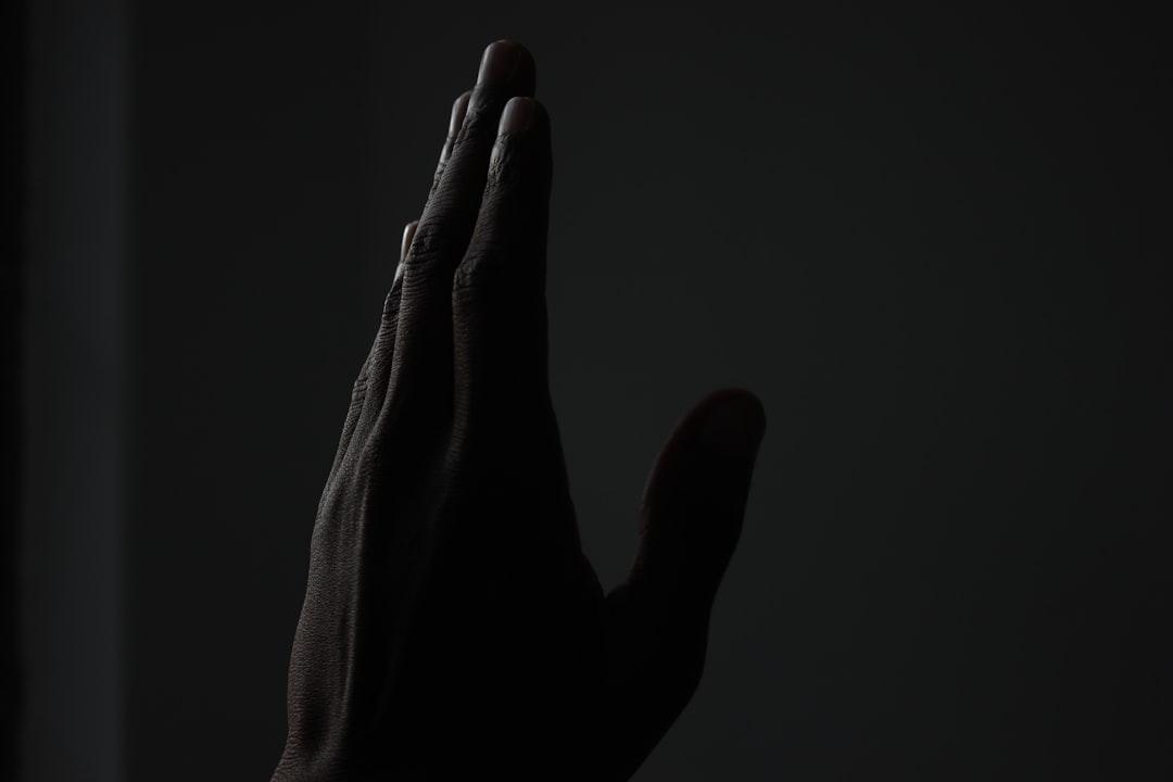 left person's hand pointing up