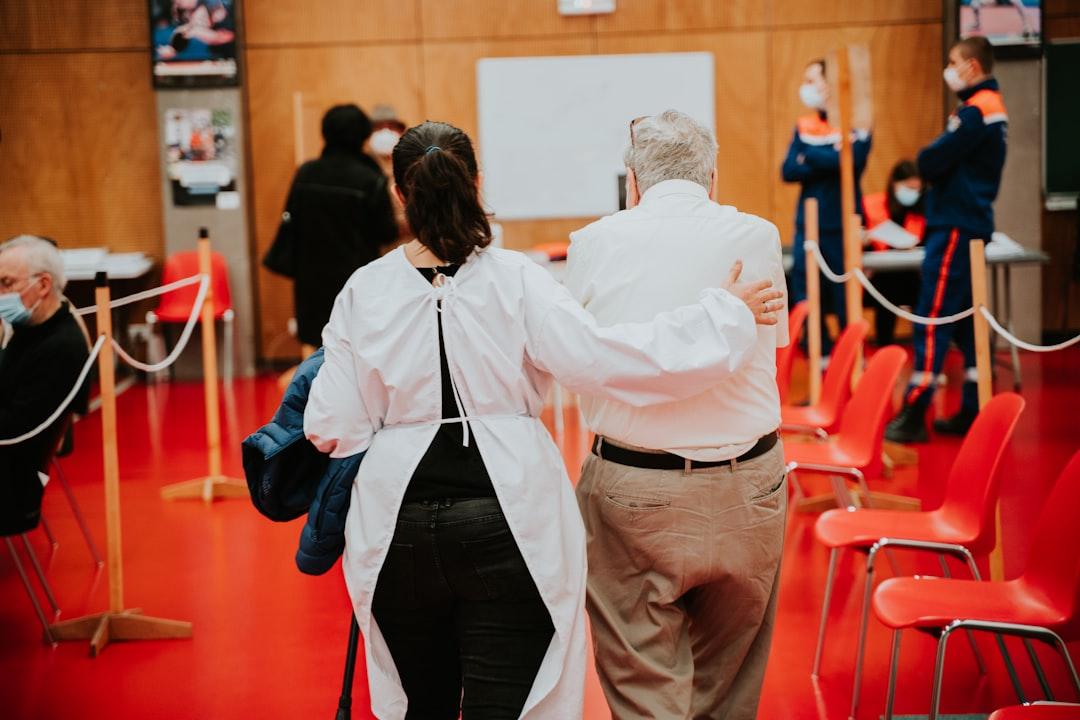 Man in white dress shirt and red pants standing beside woman in white dress shirt from Mathurin NAPOLY / matnapo on Unsplash Cúm gia cầm lại xuất hiện trong dịp Tết