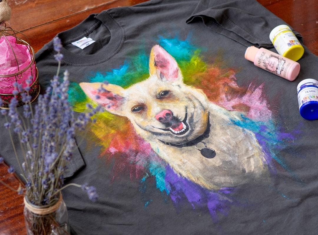 Black purple and yellow dog print crew neck shirt from Elena Mozhvilo on Unsplash