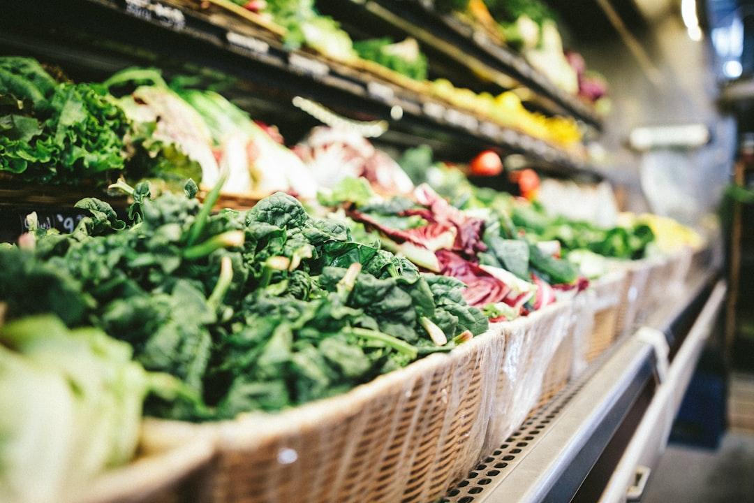 Row of vegetables placed on multilayered display fridge from Scott Warman on Unsplash