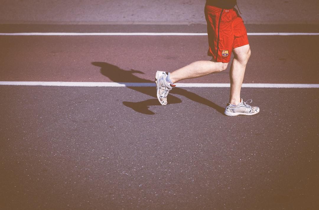 Person running on concrete road from Clem Onojeghuo on Unsplash
