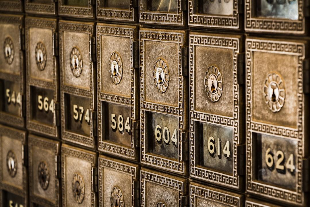 Numbers on metal deposit boxes in a bank from Tim Evans on Unsplash