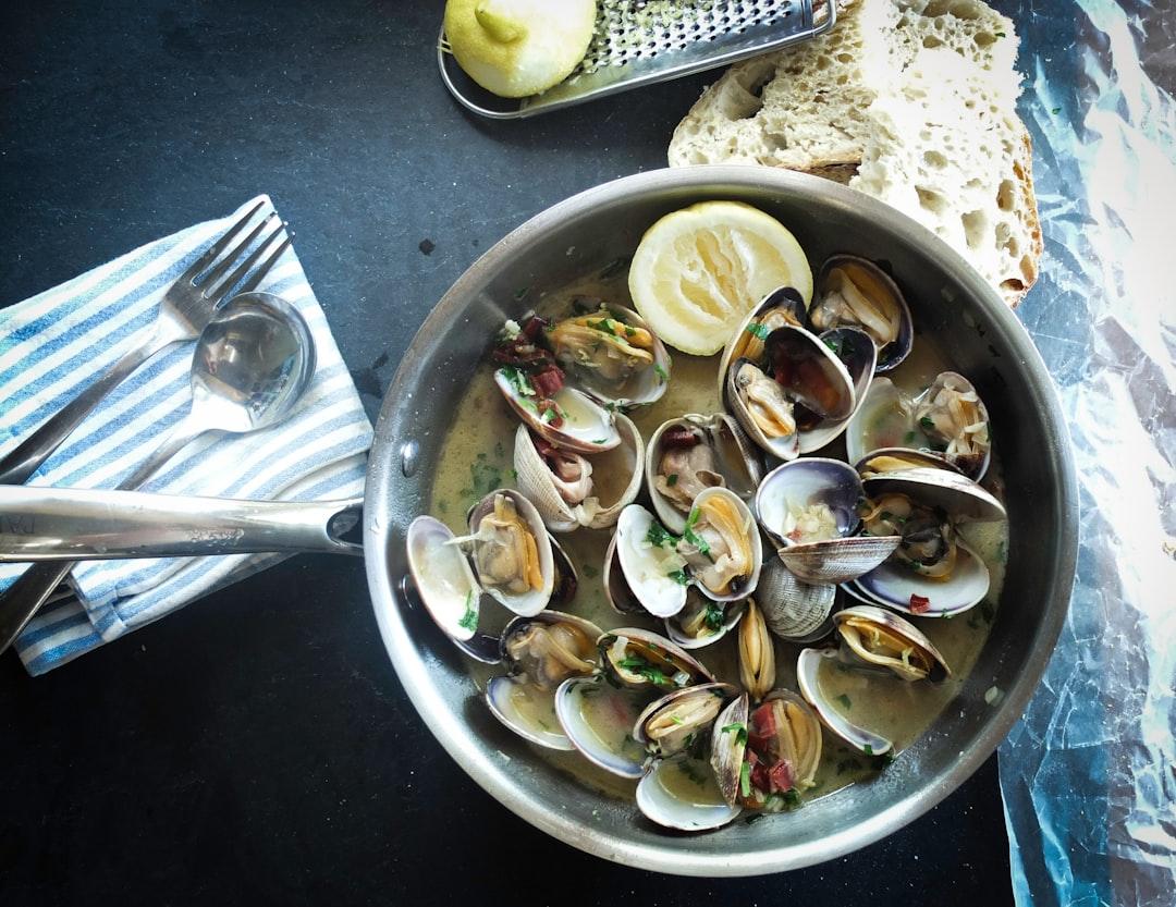 Round silver steel bowl with scallops from WikiSleep App on Unsplash