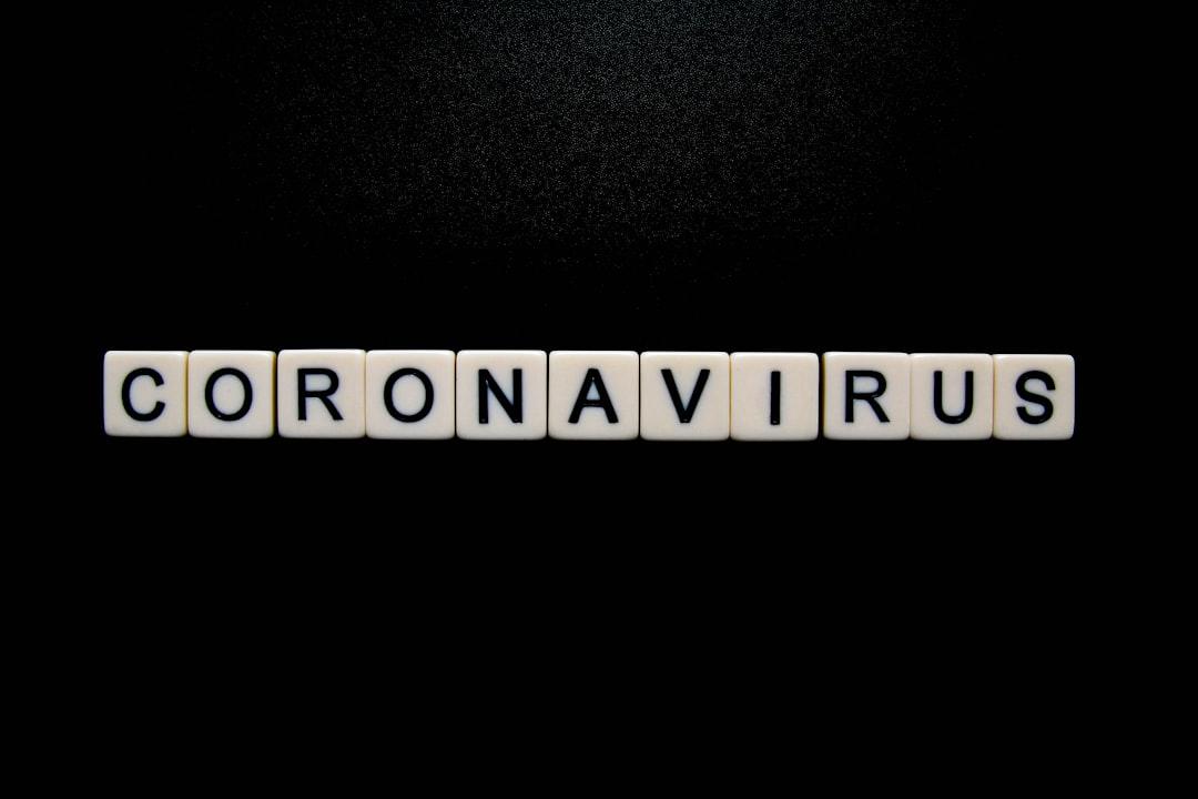 Coronavirus on black background from Glen Carrie on Unsplash Cúm A/H5N1 chưa lây từ người sang người