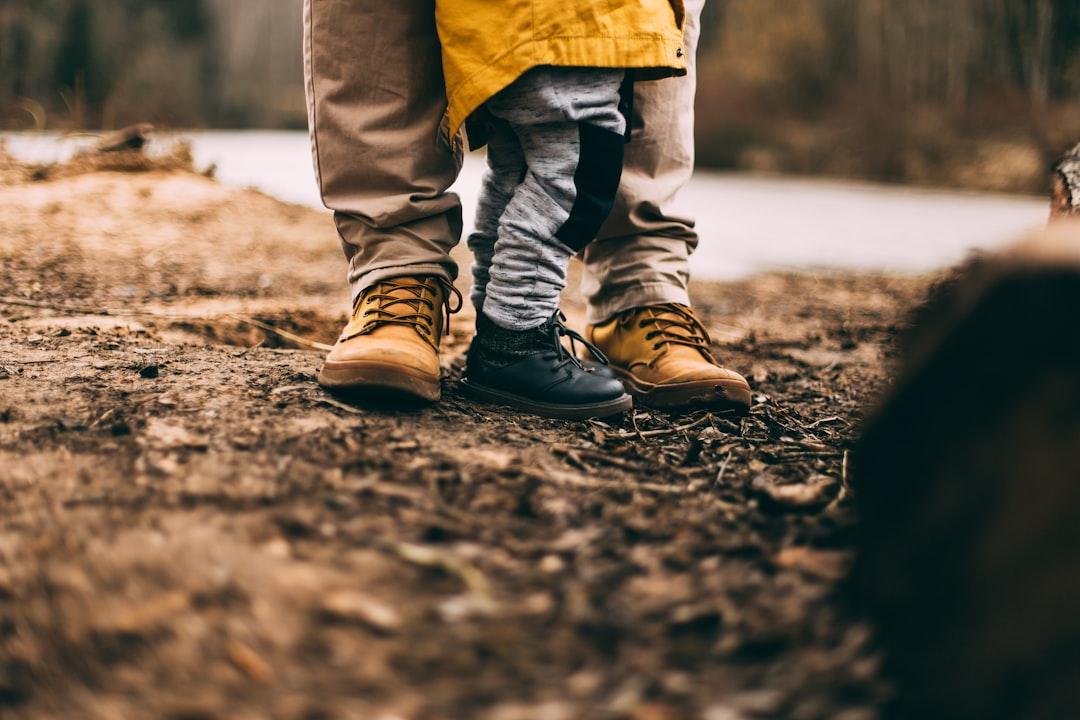 Two person step on gray soil from Daiga Ellaby on Unsplash