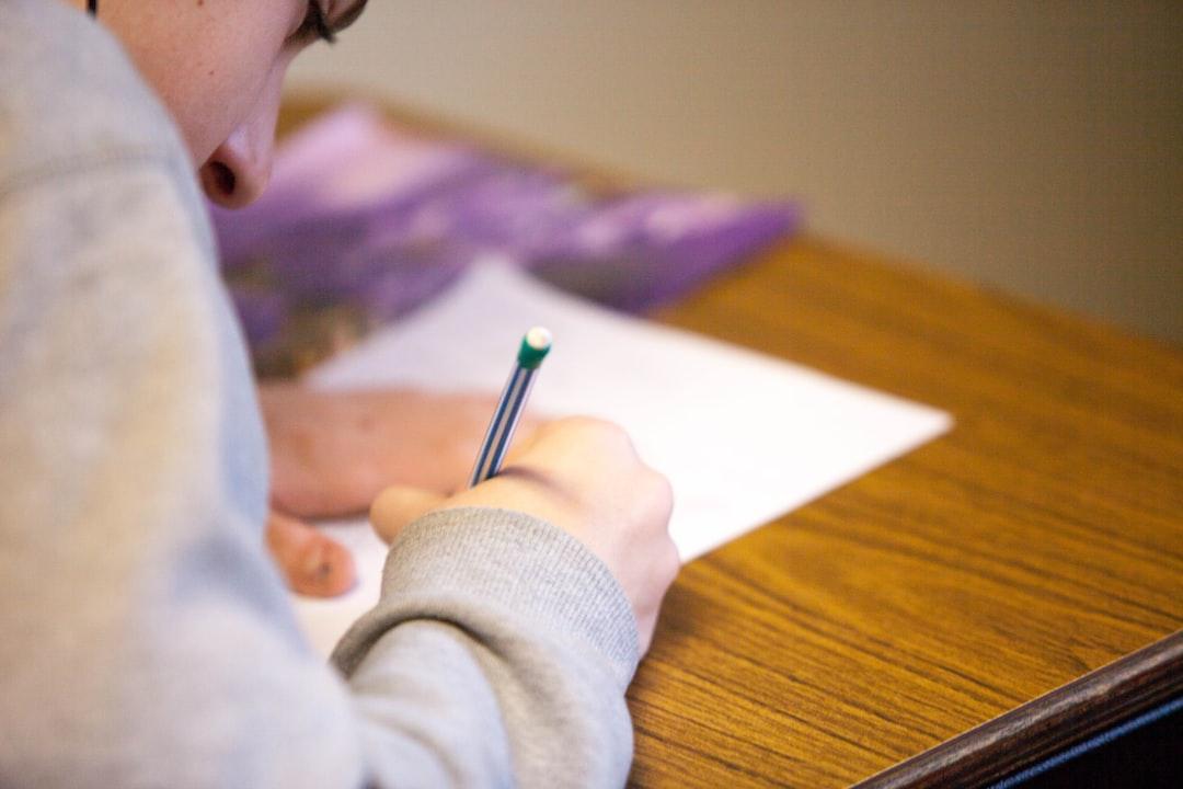 Person using pencil from Ben Mullins on Unsplash