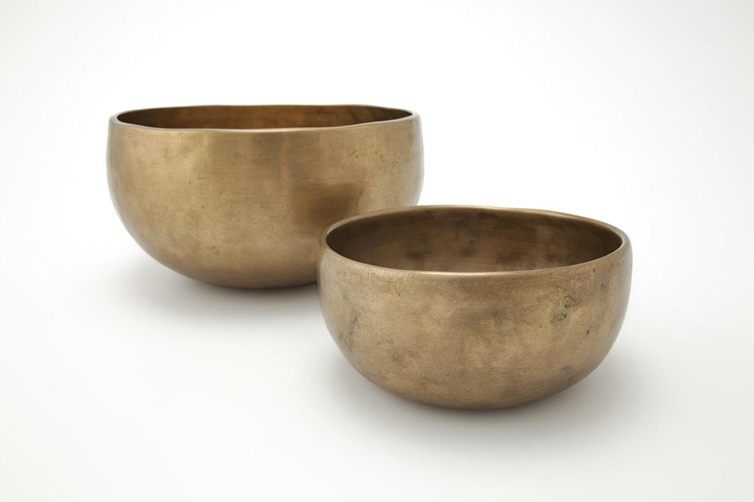 Brown ceramic bowl on white surface from Magic Bowls on Unsplash