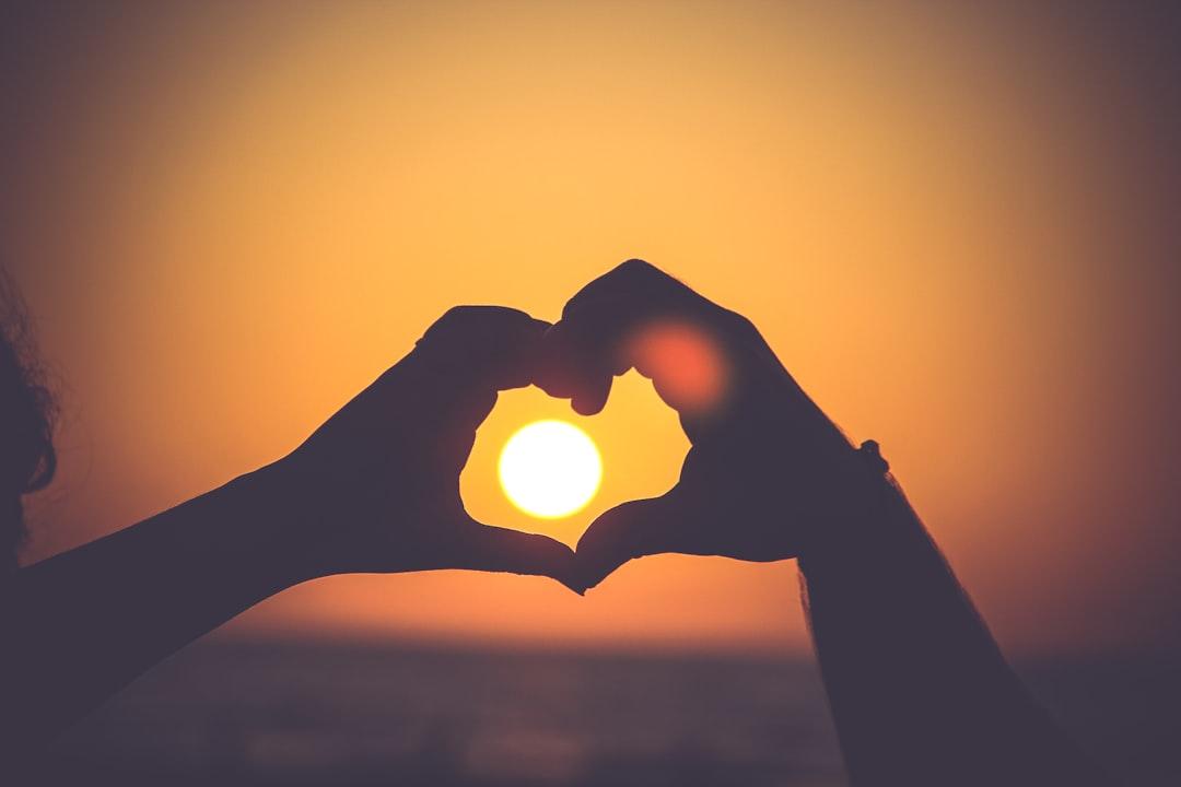 Silhouette of person's hands forming heart from Mayur Gala on Unsplash