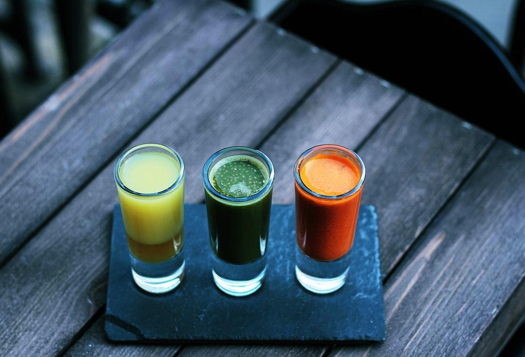 Three clear shot glasses from Toa Heftiba on Unsplash