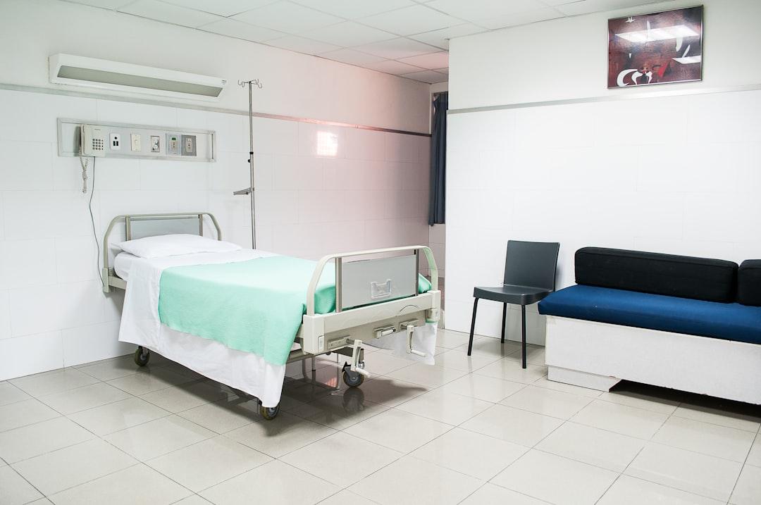 Hospital bed near couch from Martha Dominguez de Gouveia on Unsplash