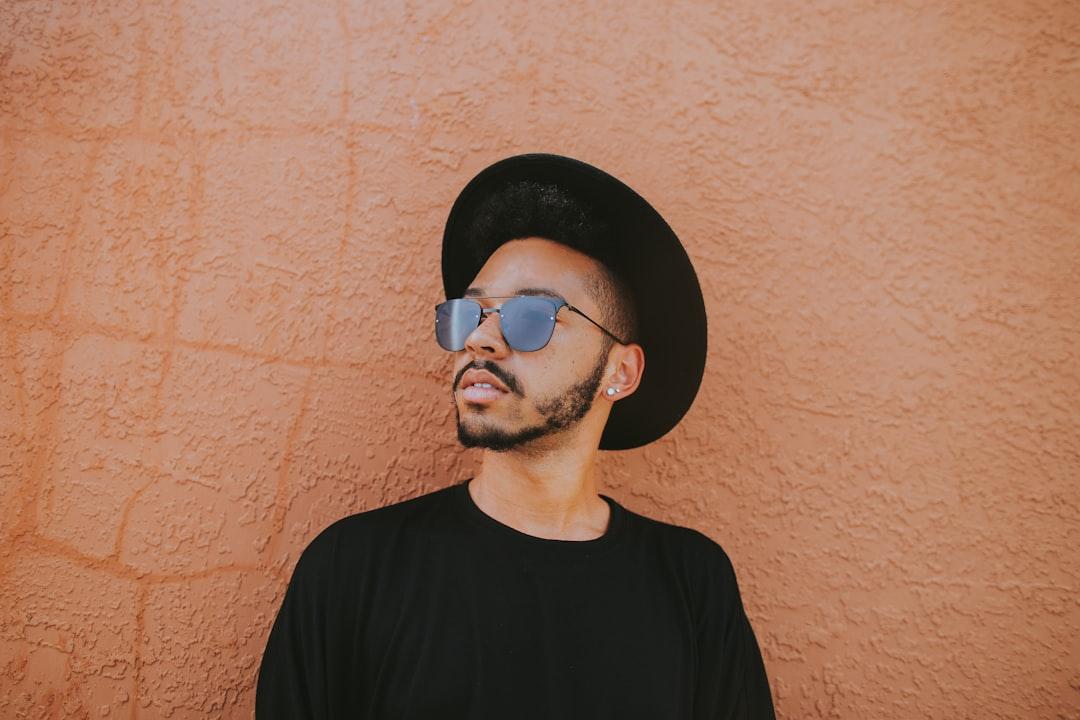 Man leaning on brown wall from Ivana Cajina on Unsplash