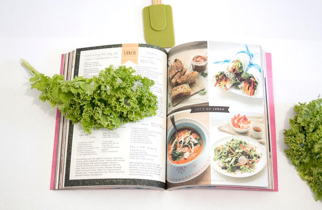 Green leaf on cookbook from S O C I A L . C U T on Unsplash