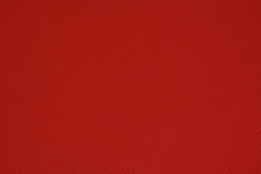 red textile in close up photography