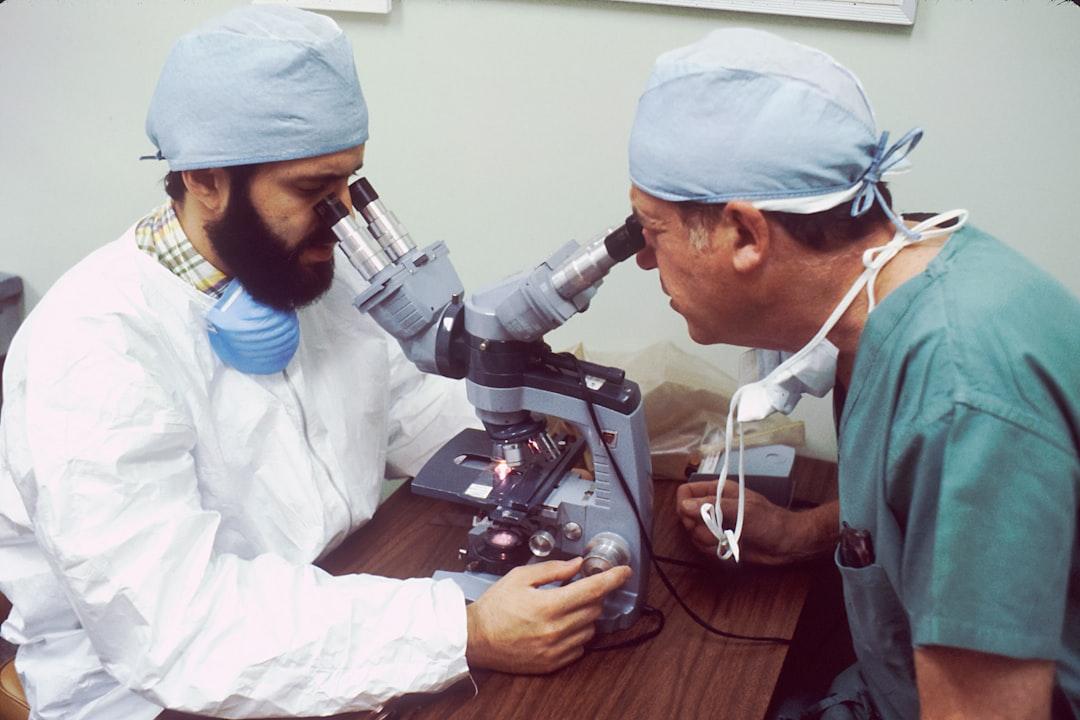 man in white dress shirt using black and gray video camera Pantothenic acid (B5)