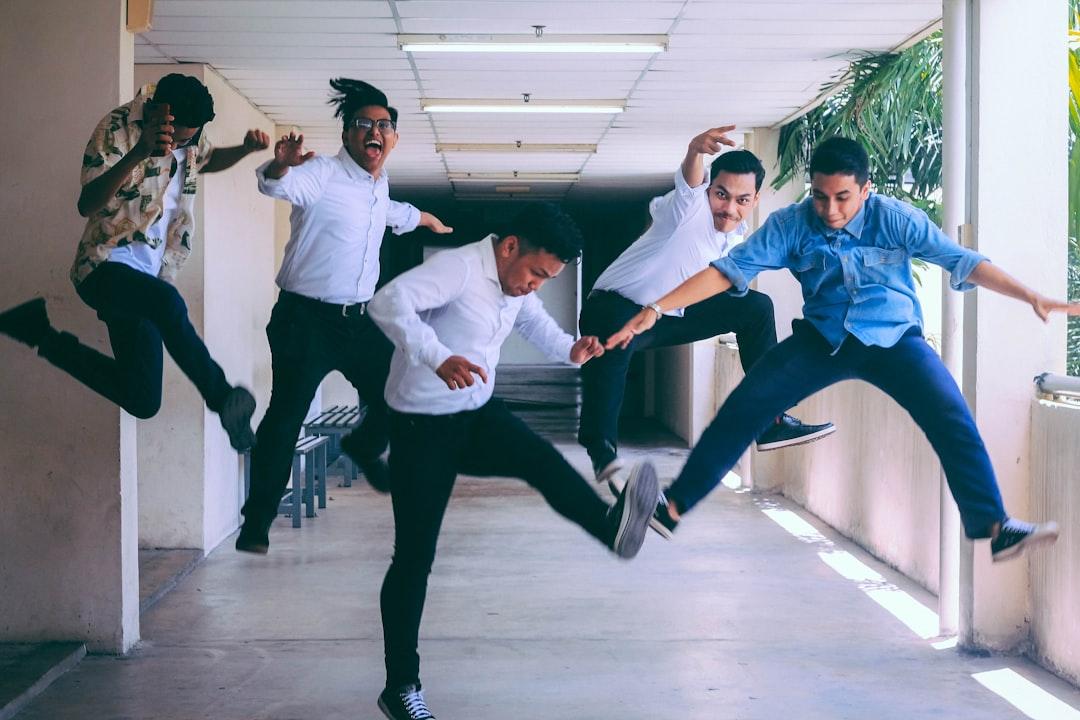Group of people doing jump shot photography from Husna Miskandar on Unsplash